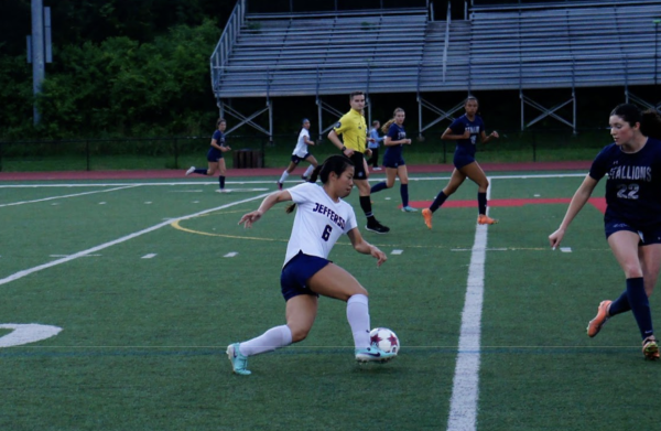 Working her way around multiple defenders, junior Anna Chau keeps the ball away from the opposing team while making her way to the goal. The players train weekly, even when they have two or more games a week. “During the regular season and even the preseason, we are working as hard as we can so that we can tone it down during the practices when all the games are like every other day,” Chau said. 